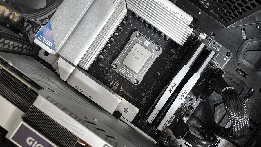 Close-up of an open PC case showing a CPU, motherboard and graphics card