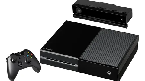 Black games console with a matching wireless controller and motion camera