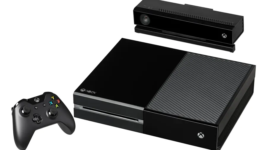 Black games console with a matching wireless controller and motion camera