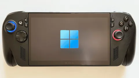Handheld gaming PC showing the Windows logo on screen during startup