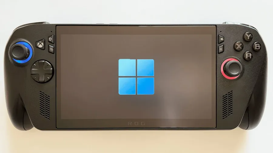 Handheld gaming PC showing the Windows logo on screen during startup