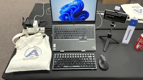 Laptop with a mouse on a table, its screen showing the Windows desktop