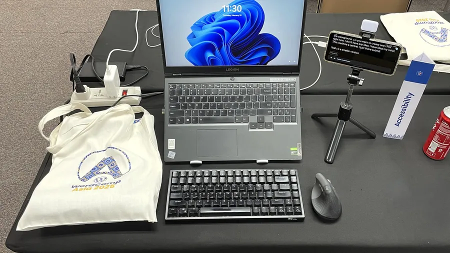 Laptop with a mouse on a table, its screen showing the Windows desktop