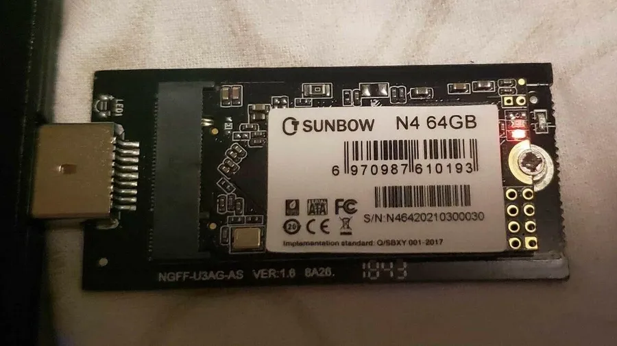 Small M.2 solid-state drive fitted in a USB adapter board