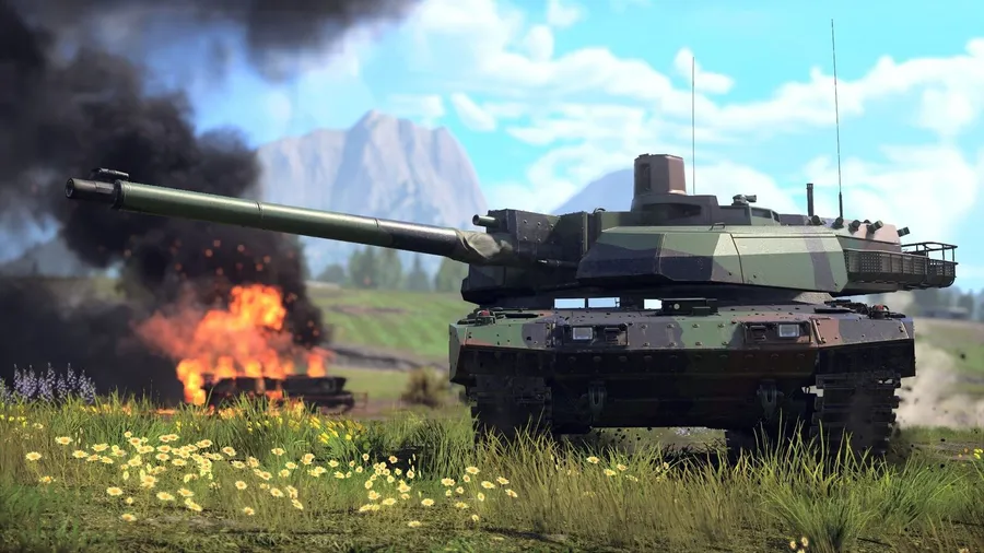 Modern main battle tank on a grassy hill with a burning vehicle behind it in War Thunder